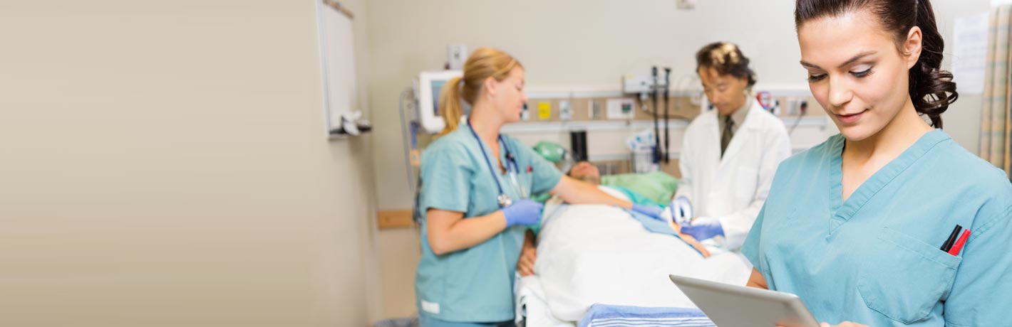 Image of doctor nurses around patient bed.