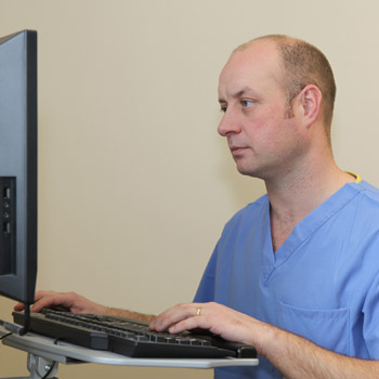 Dr. Gavin Wood at computer terminal.