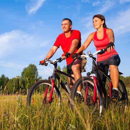 Image of a couple cycling.