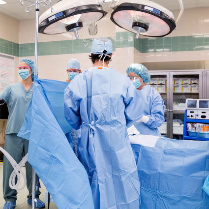 Image of doctor and nurses in surgery.